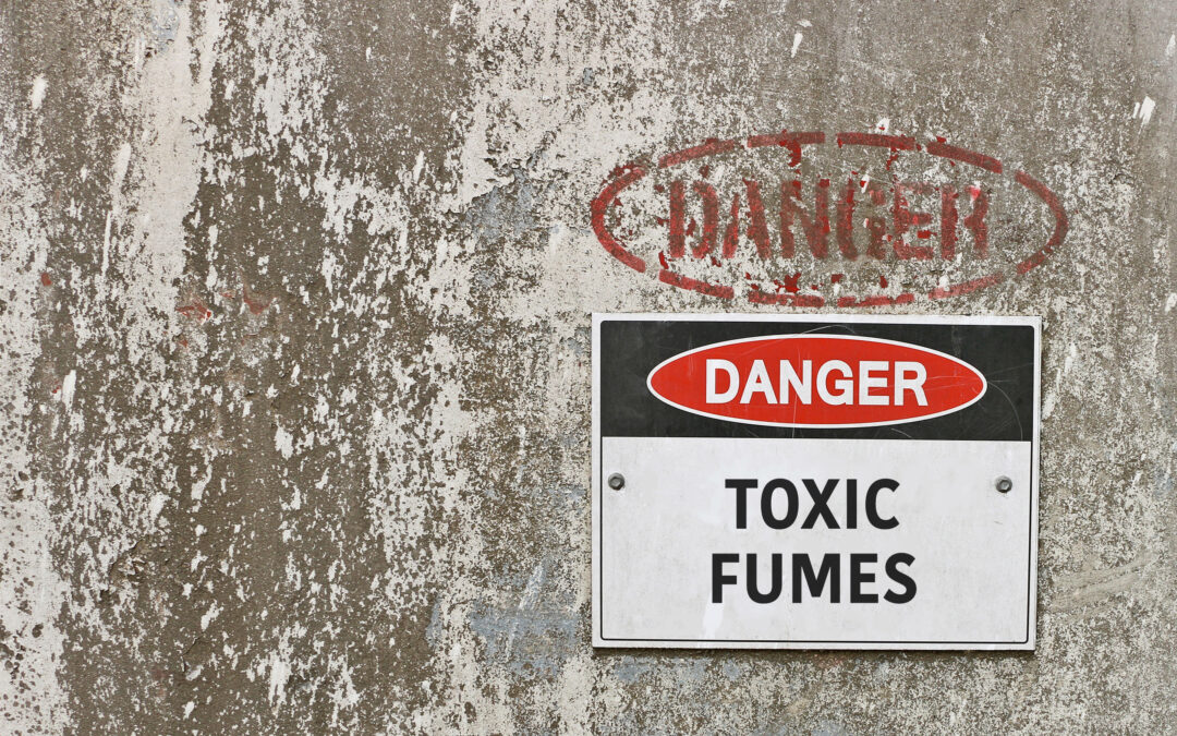 red, black and white Danger, Toxic Fumes warning sign