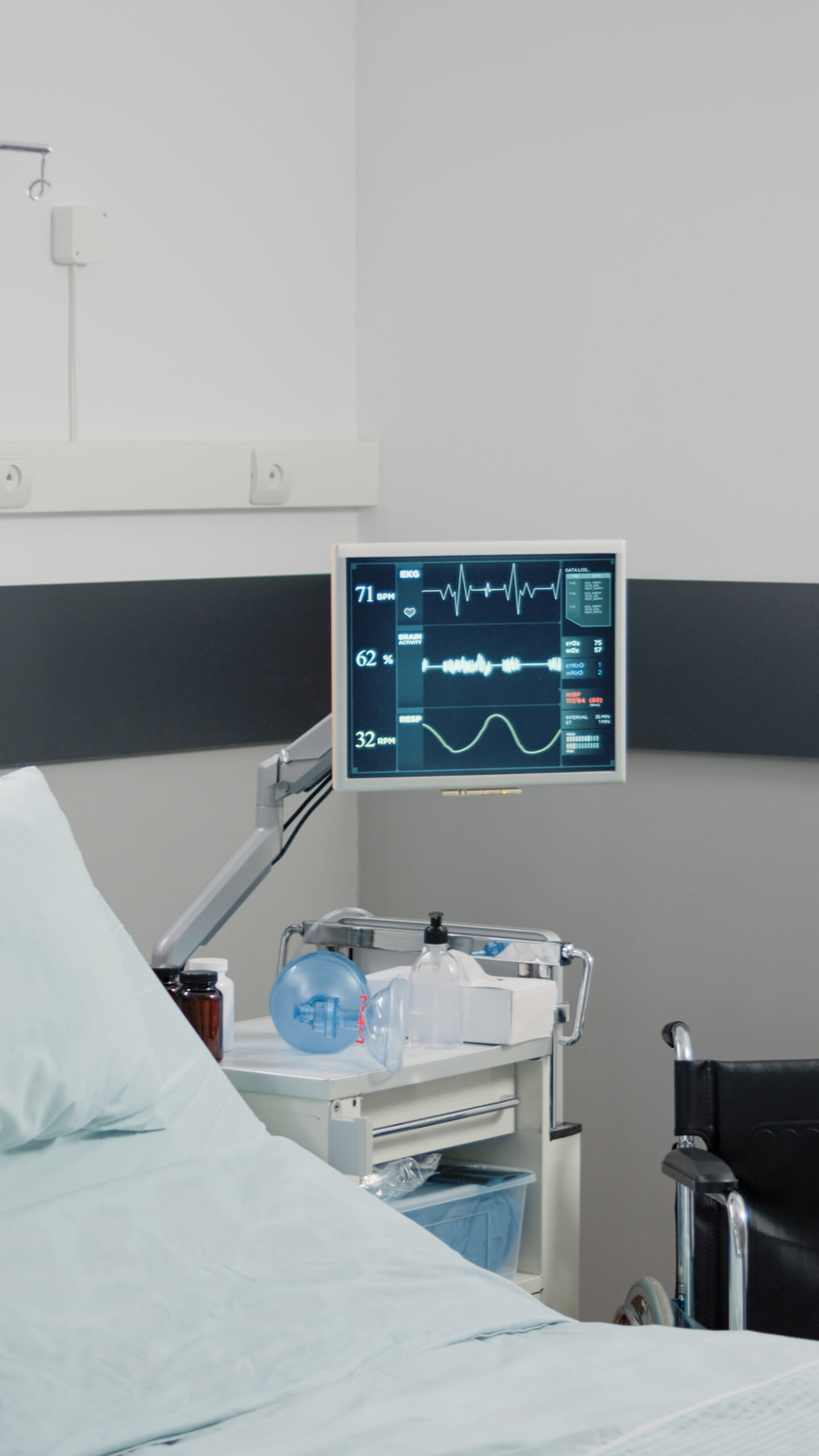 Nobody in hospital ward with bed and heart rate monitor for reanimation and healthcare. Empty emergency room with medical instruments and equipment for intensive care. Space for recovery