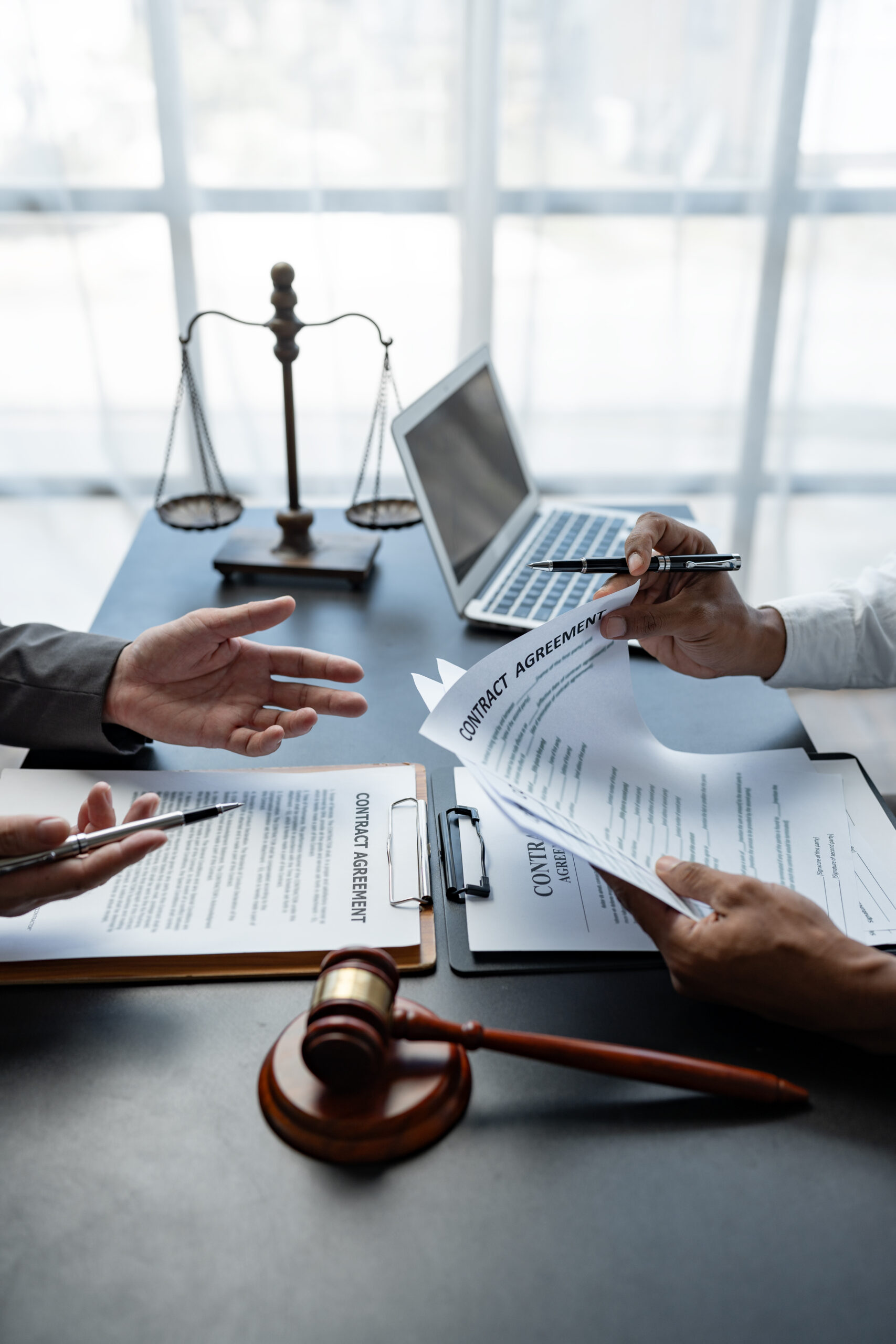 Attorneys consulting and examining contract documents