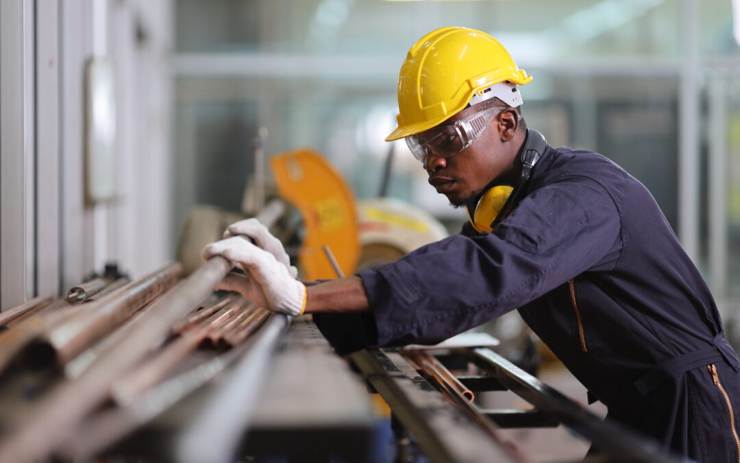 African American mechanic engineer worker is choosing copper tub