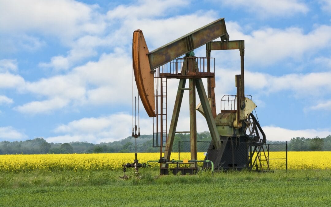 abandoned industrial oil pump in field