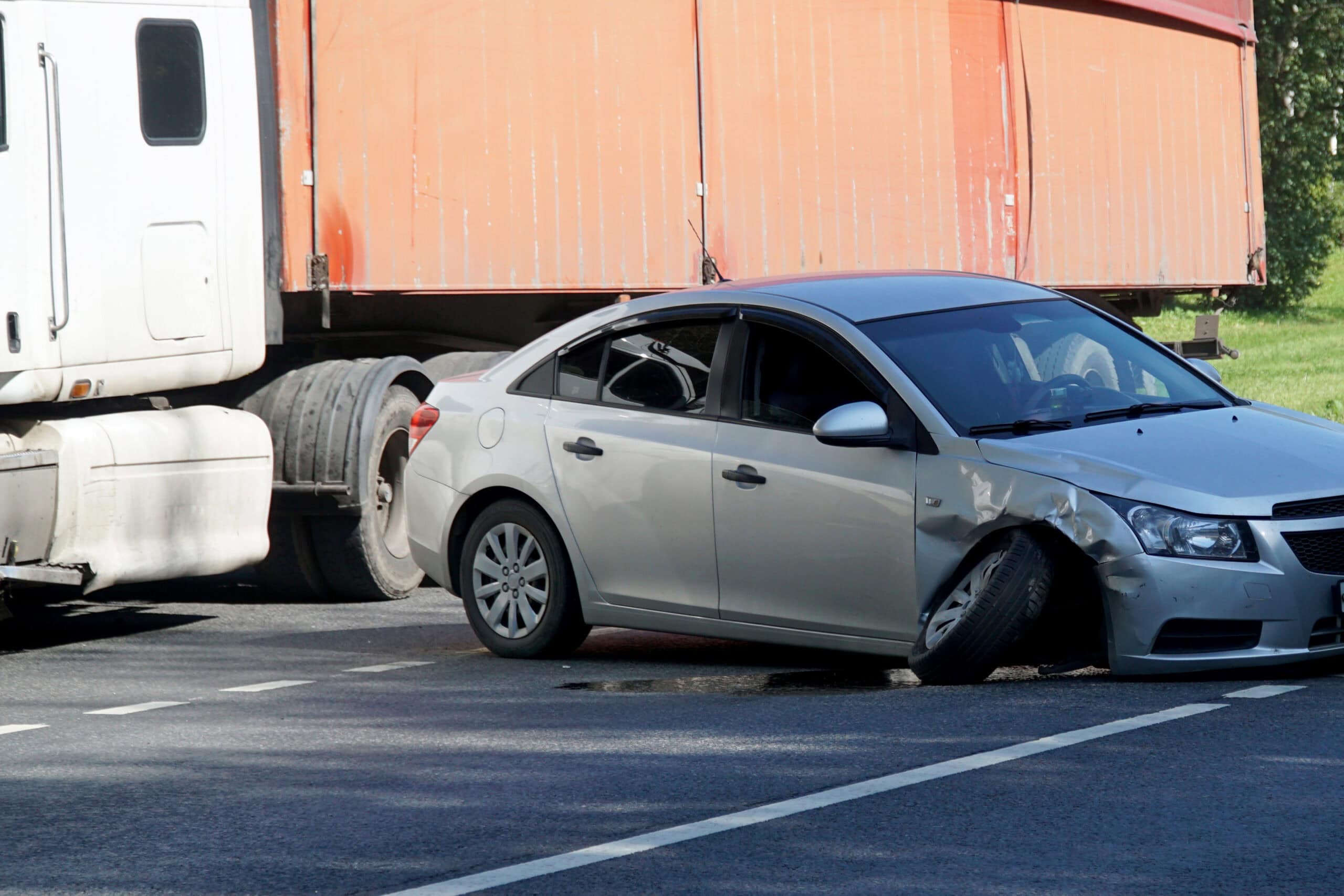 Emergency car on the road with a broken front wheel suspension.