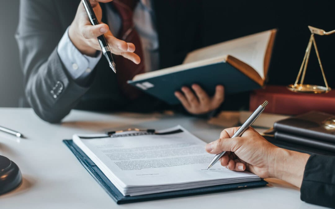 attorney and person discussing a contract