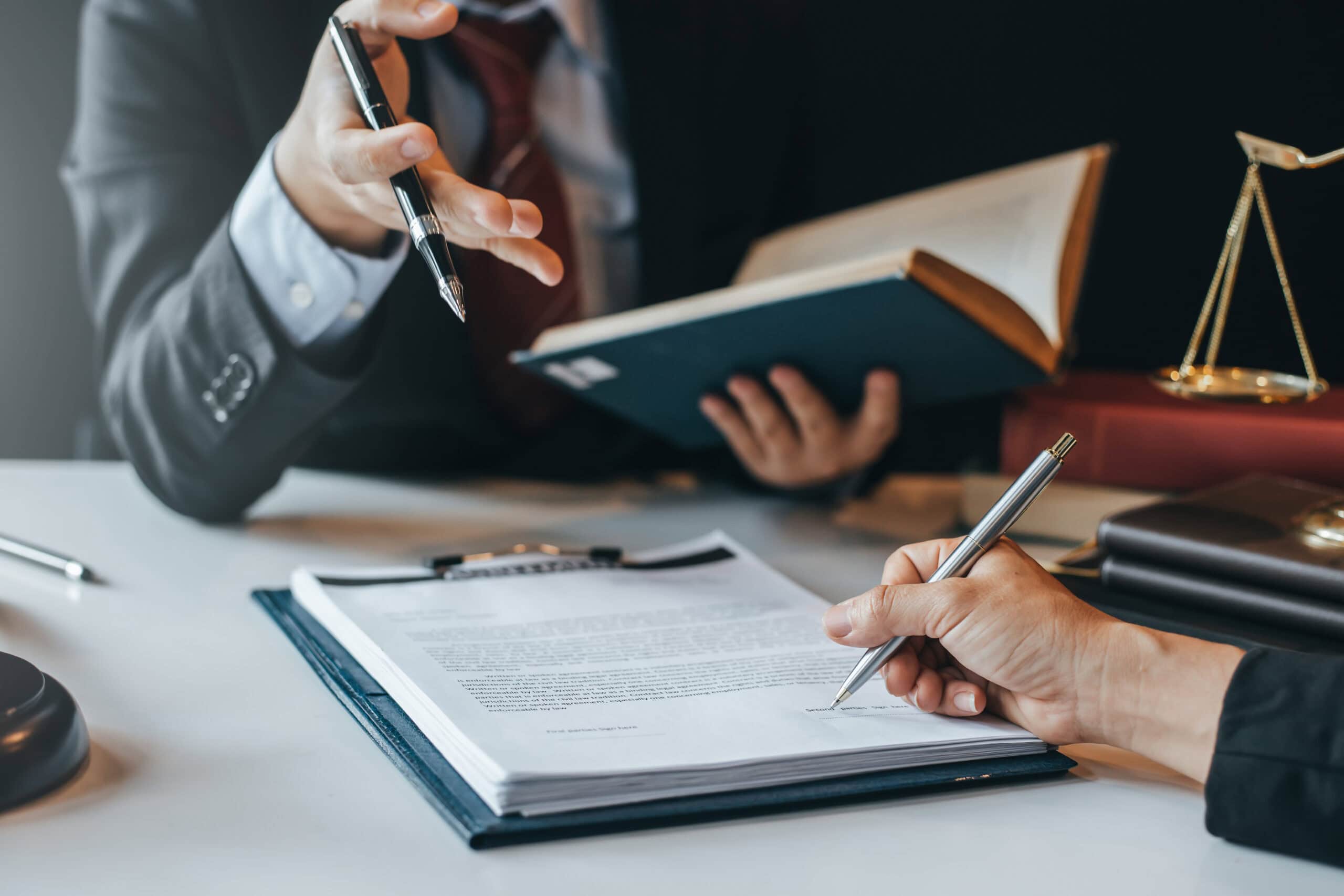 attorney and person discussing a contract