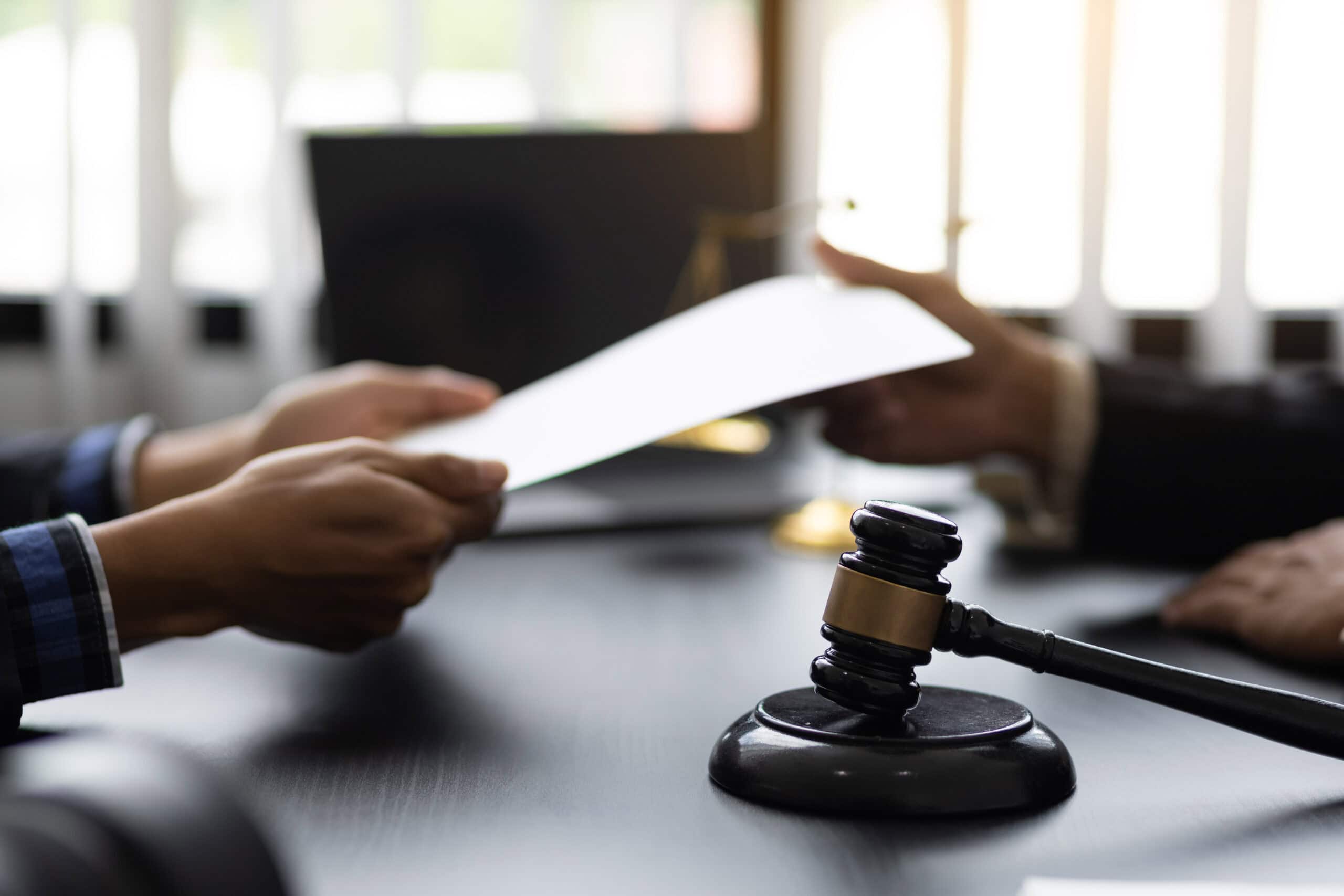 person meeting with their attorney