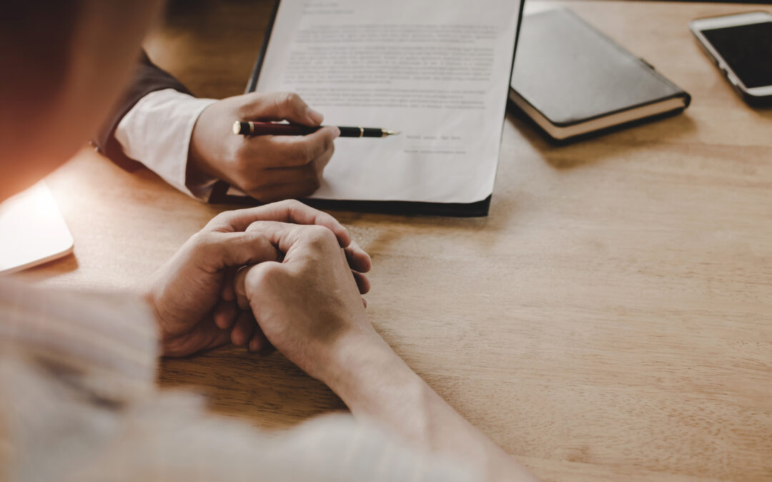 client reviewing legal paperwork with attorney
