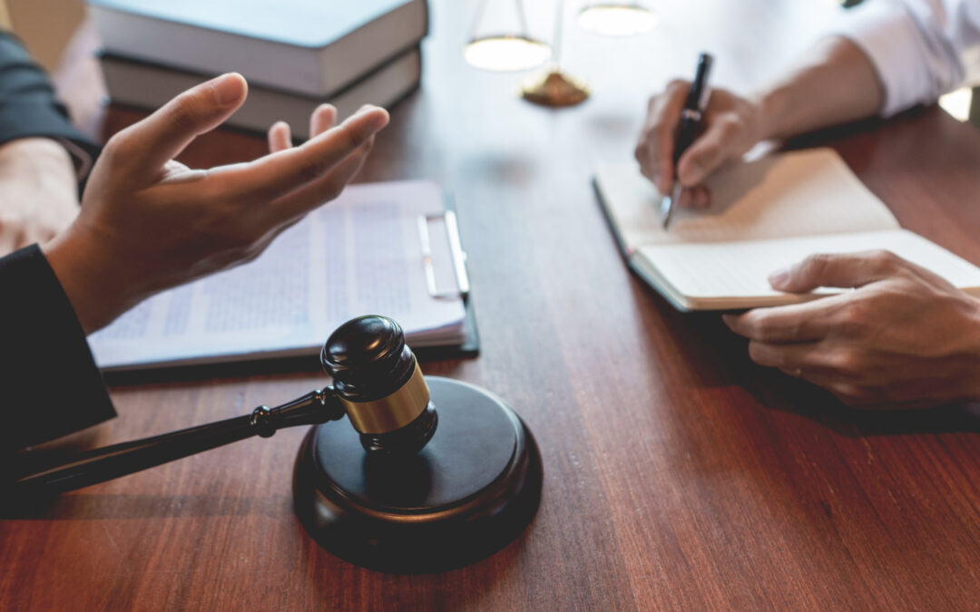 attorney discussing contract papers with client in office