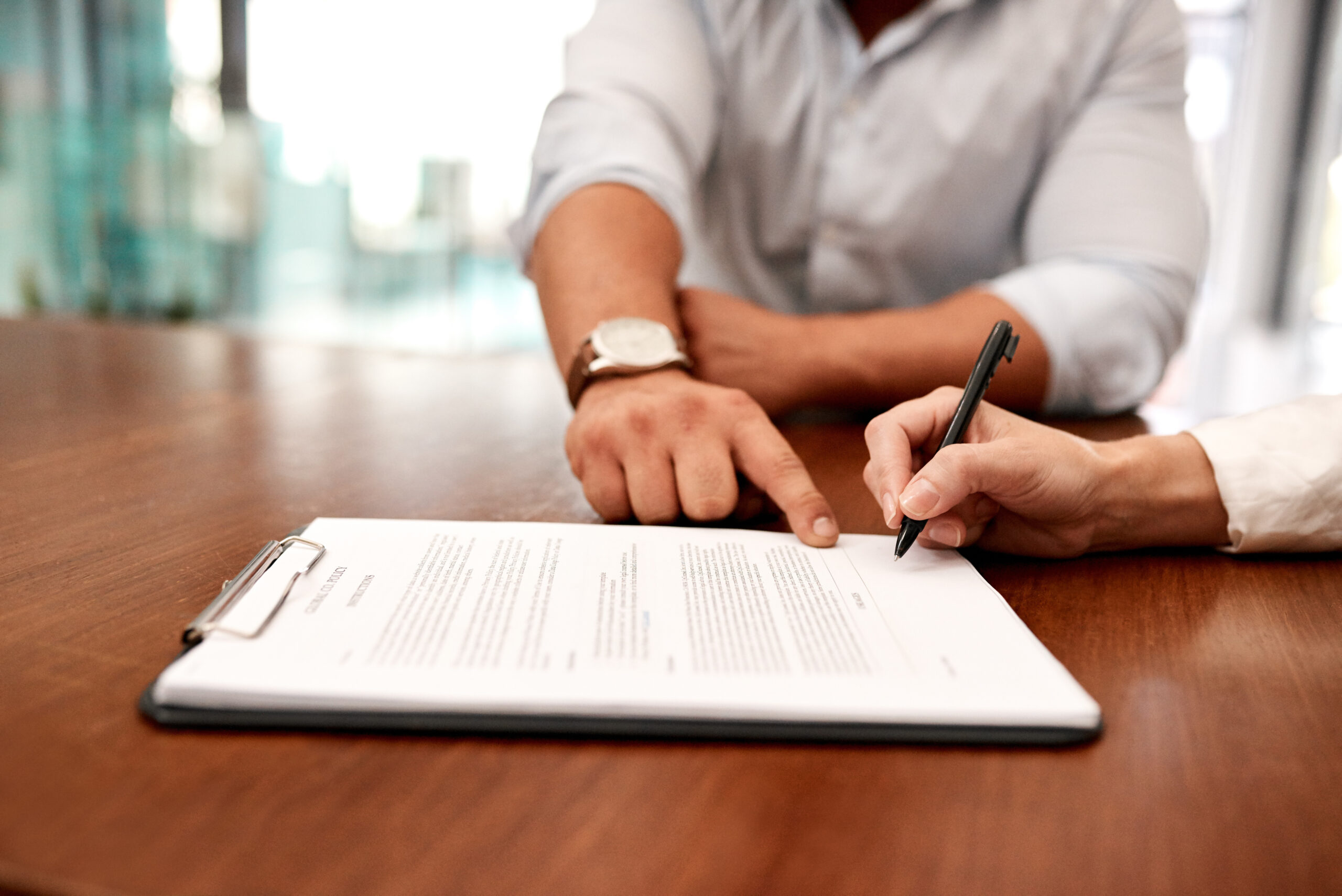 client and attorney reviewing contract