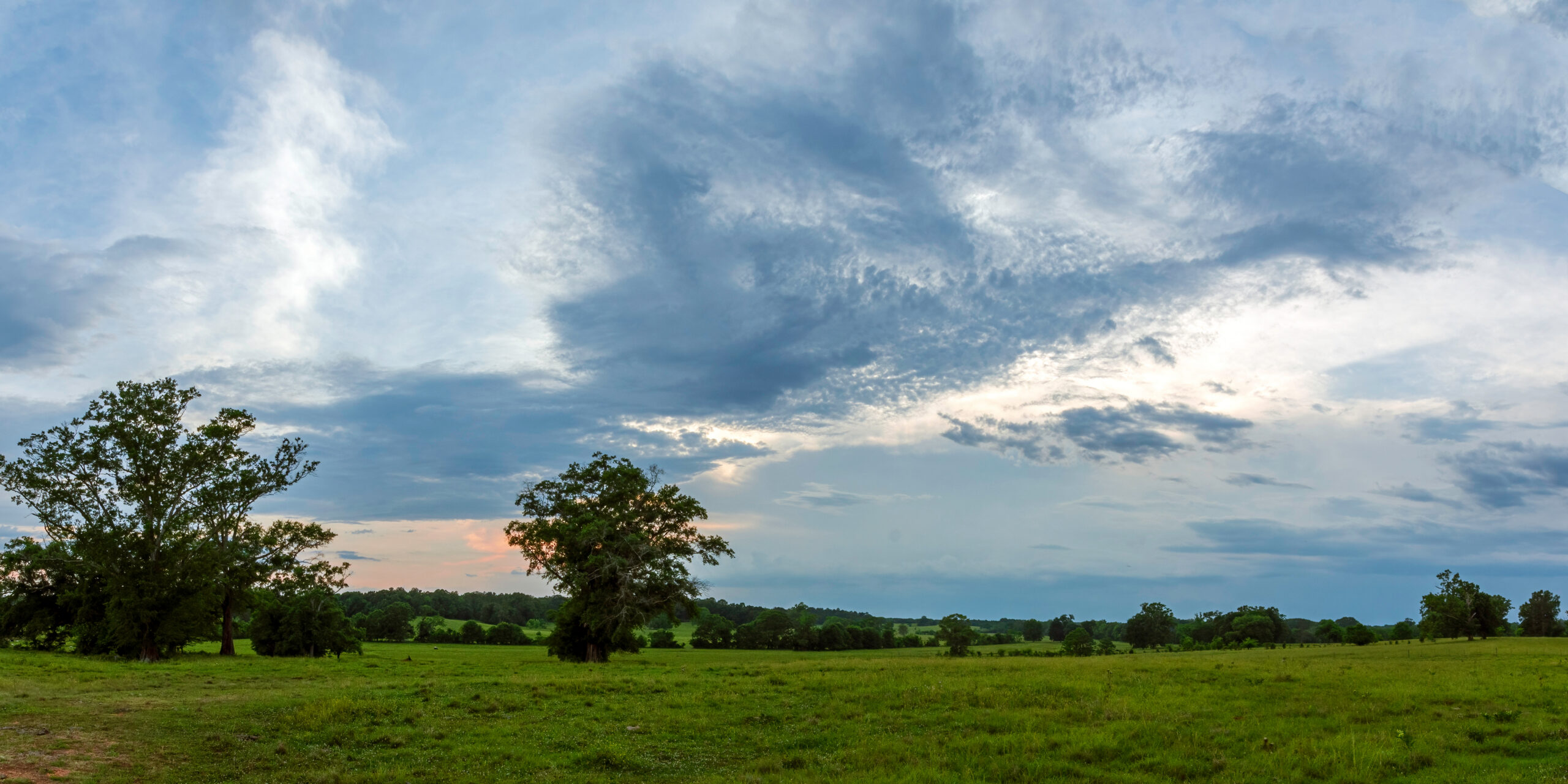 Panoramic view of countryside with dramatic sky